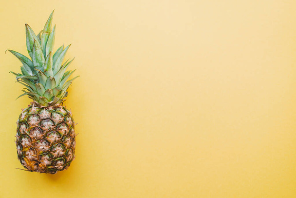 colored surface with pineapple. High quality photo - Photo, Image