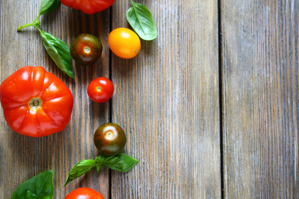 wooden background with ripe tomatoes - Photo, image
