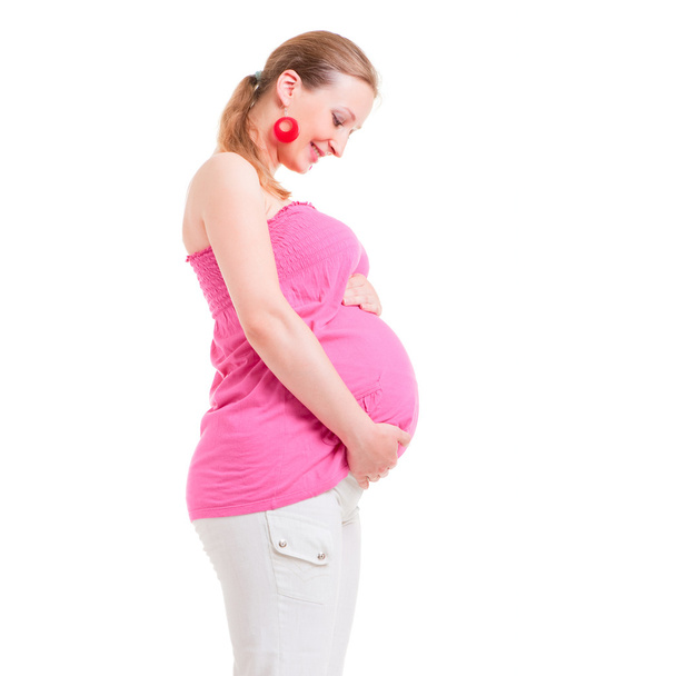 Sideview of beautiful pregnant woman - Фото, зображення