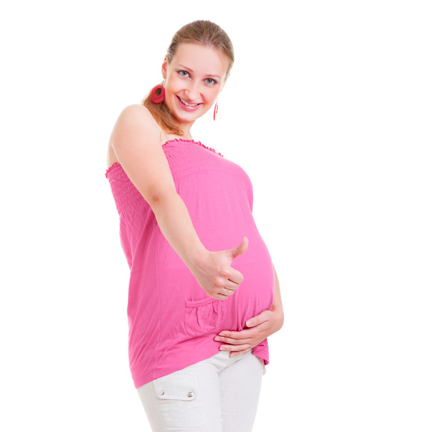 Mujer embarazada sonriente mostrando los pulgares hacia arriba
 - Foto, Imagen