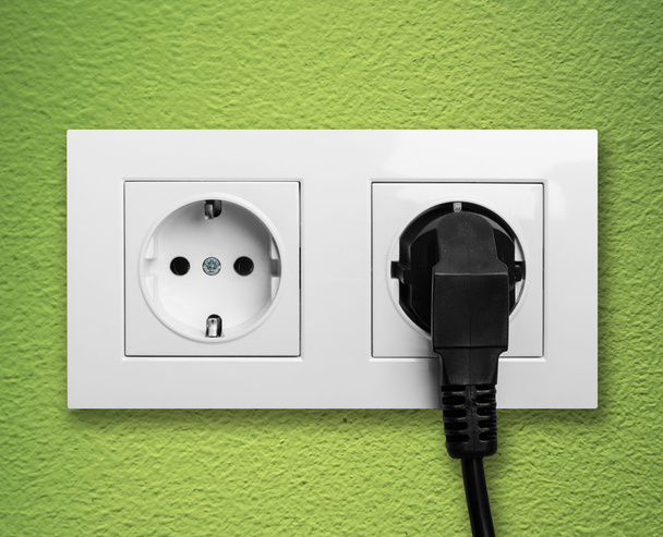 Electric outlet with cable plugged - Photo, Image