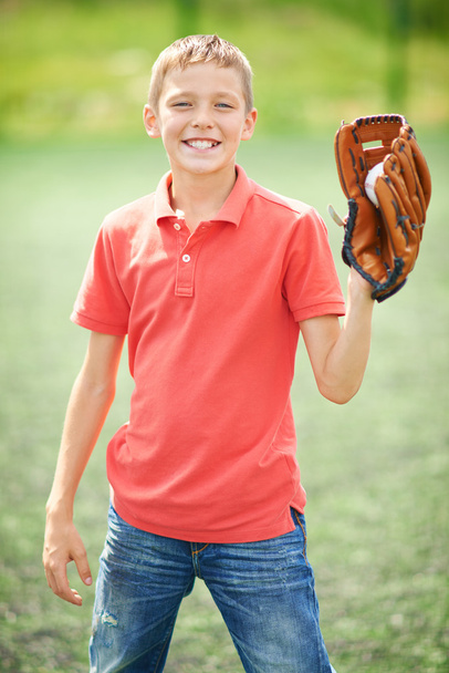 Boy with caught baseball - Foto, afbeelding
