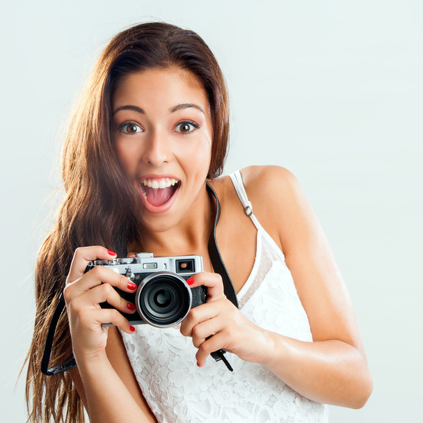 Cute girl holding retro camera. - Zdjęcie, obraz