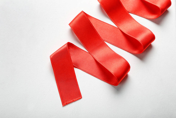 Red ribbon on white background, closeup - Valokuva, kuva