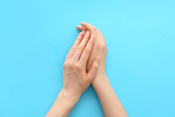 Female hands on color background - Photo, Image