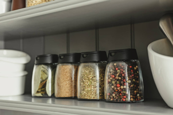 Jars with different spices on shelf - Foto, Imagem