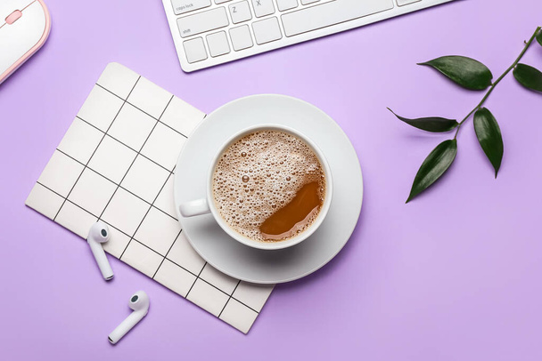 Cup of coffee, notebook, earphones and keyboard on color background - Photo, Image