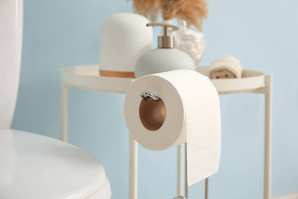 Holder with roll of toilet paper in bathroom, closeup - Φωτογραφία, εικόνα
