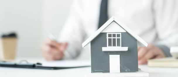 Agents working in real estate investment and home insurance signing contracts in accordance with the home buying insurance agreements approving purchases for clients. - Φωτογραφία, εικόνα