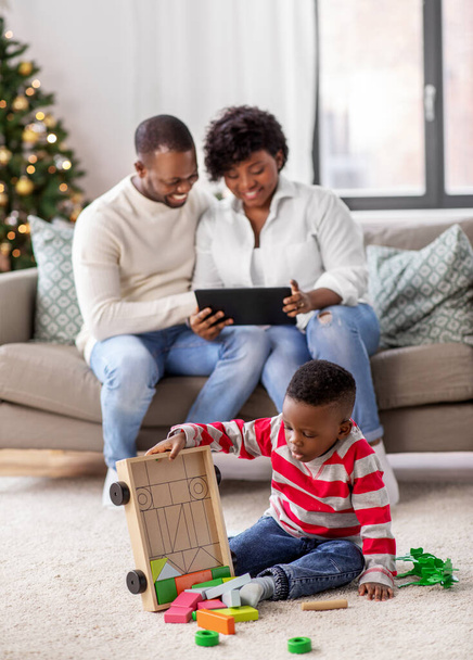 happy african american family on christmas at home - 写真・画像