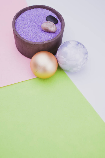 vase with colored sand and Christmas ball decorations on a white background with copy space - Photo, Image