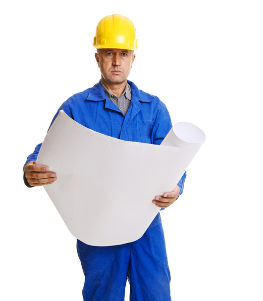 Serious handsome worker with blueprint - Foto, afbeelding