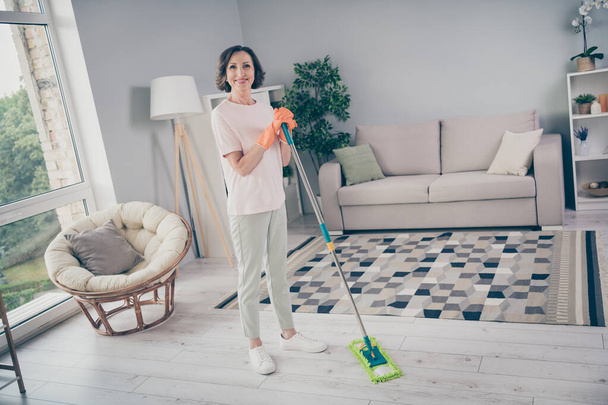 Photo portrait smiling senior woman cleaning the house washing floor staying at home - Zdjęcie, obraz