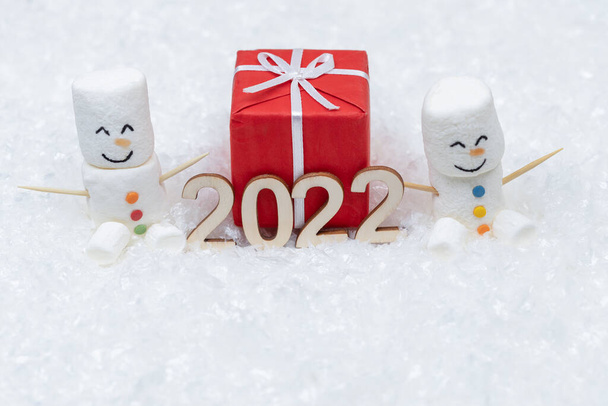 New Year and Merry Christmas 2022. Snowman from marshmallows. New Year theme. - Fotó, kép