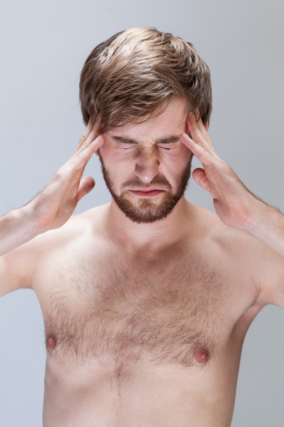 Man suffering from headache - Foto, afbeelding