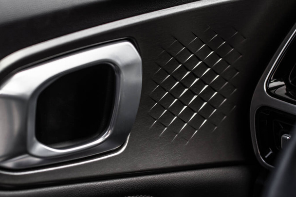 Modern car interior door handle close up. Metallic Car door opener handle inside. - Фото, зображення