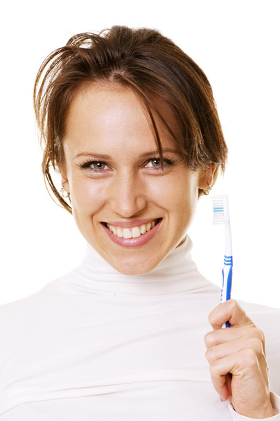 Щаслива жінка з зубною щіткою
 - Фото, зображення