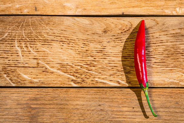 Red hot peppers on wooden table - Photo, Image