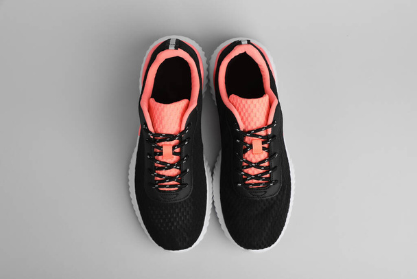 Pair of comfortable sports shoes on grey background, flat lay - Fotoğraf, Görsel