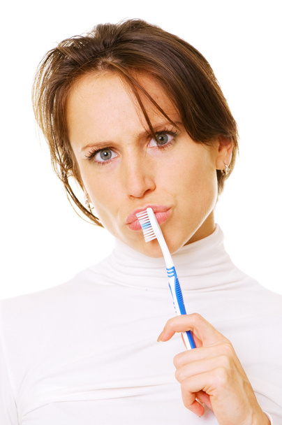Woman with toothbrush thinking - Photo, Image