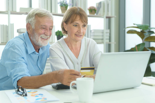 Caucasian senior people holding credit card, shopping online concept - Photo, Image