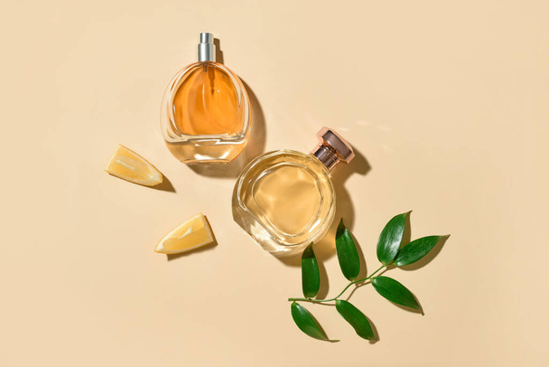 Composition with different bottles of elegant perfumes on color background - Photo, image