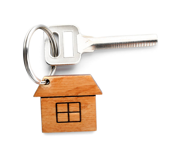 Key and wooden house shaped keychain on white background - Photo, Image