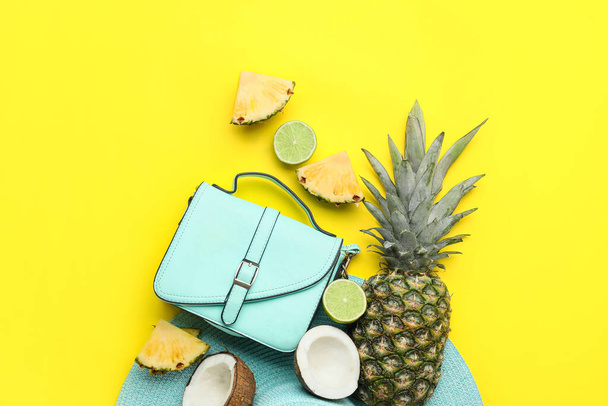 Composition with stylish bag and fruits on color background - Фото, изображение