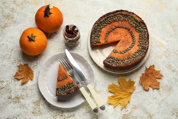 Composition with delicious pumpkin pie on light background - Photo, Image