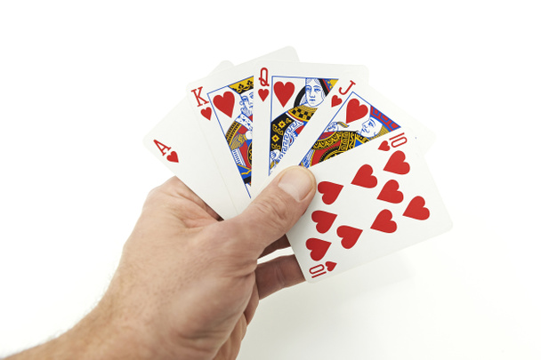 Poker speler bedrijf royal flush - Foto, afbeelding