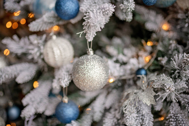 Christmas tree festively decorated with balls   - Фото, изображение