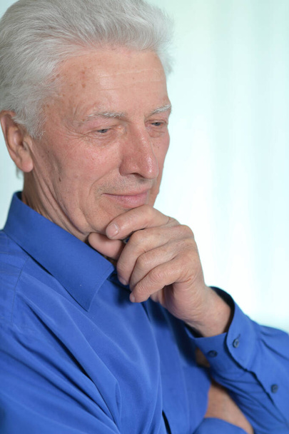 Portrait of a handsome senior man thinking  - Фото, изображение