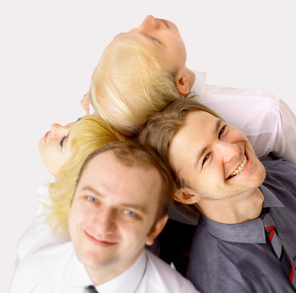 A team of happy business looking upwards at copyspace - Фото, изображение