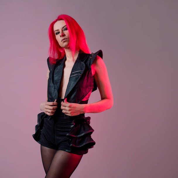 Goth sexy look. young attractive woman with pink hair - 写真・画像