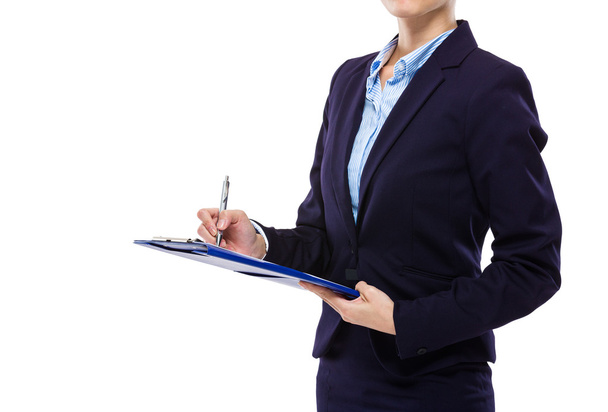 Businesswoman write on clipboard - Foto, afbeelding