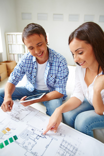 Couple discussing plan of new flat - Photo, Image