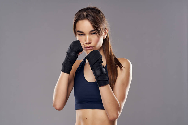 pretty woman in boxing bandages workout fitness fighter isolated background - Photo, Image