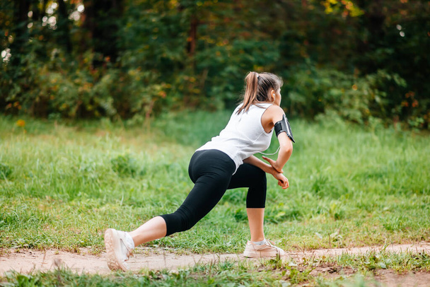 Woman running in autumn fall forest. Healthy lifestyle . Fit ethnic Caucasian fitness model. - Φωτογραφία, εικόνα