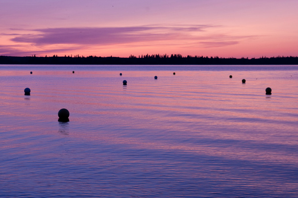 Sunset with Buoys on Water - 写真・画像