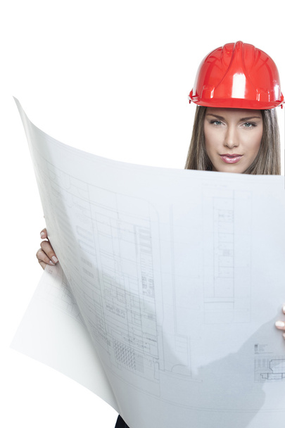 Female architect holding a blueprint isolated on white - Foto, imagen