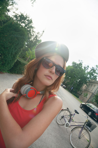 Young Woman With Headphones Outdoors - Fotó, kép