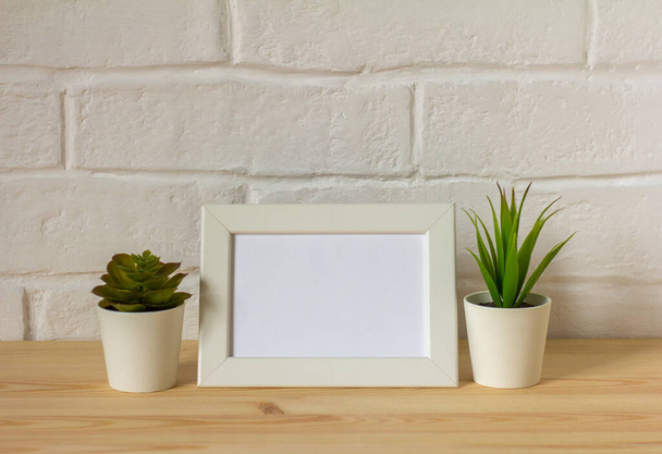 mock up empty photo frame on table or shelf with copy space - Φωτογραφία, εικόνα