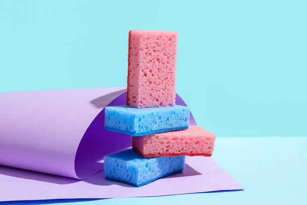 Cleaning sponges on blue background - Фото, изображение