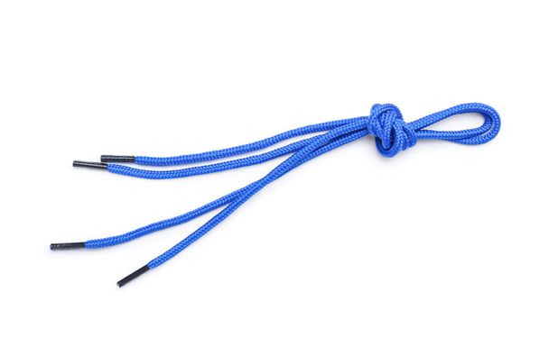 Zapato azul con cordones atados en nudo sobre fondo blanco - Foto, imagen