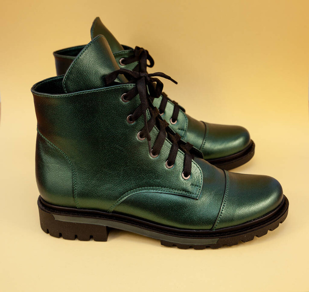 Green boots. Casual shoes classic. Leather modern boots. Boot with laces. Womens winter boot. Shoe. - 写真・画像