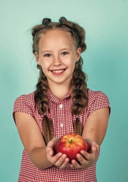 happy teen kid with apples full of vitamin picked from autumn harvest, autumn - Фото, изображение