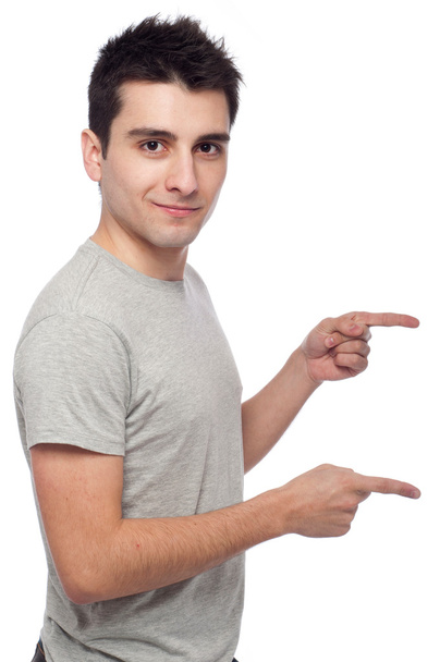 Casual man pointing - Фото, изображение
