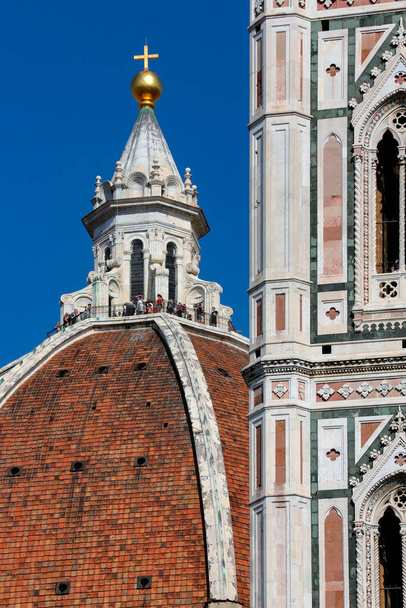 Florence Cathedral (The Duomo) in the city of Florence (Firenze) in the Tuscany region of Italy. The dome of the cathedral was built by Filippo Brunelleschi. and nearby Campanile was designed by Giotto.  UNESCO World Heritage Site. - Zdjęcie, obraz