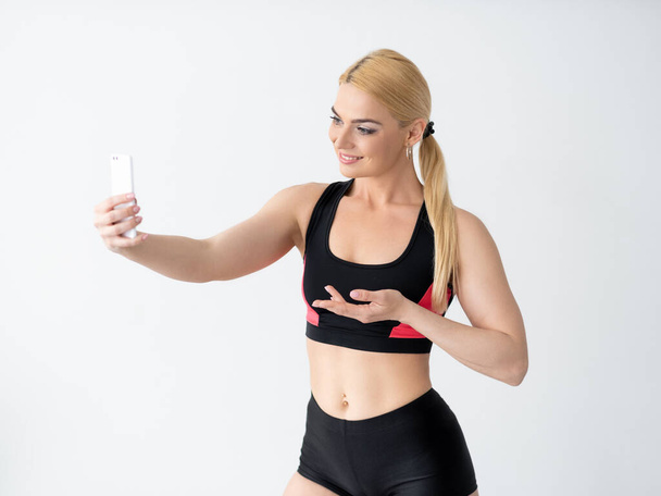 athletic woman promoting hand sport influence - Photo, image