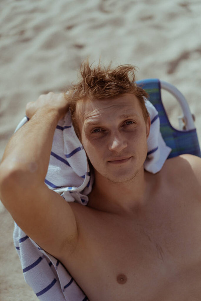 Beach Miami Florida USA, a young man resting on the beach  - Valokuva, kuva